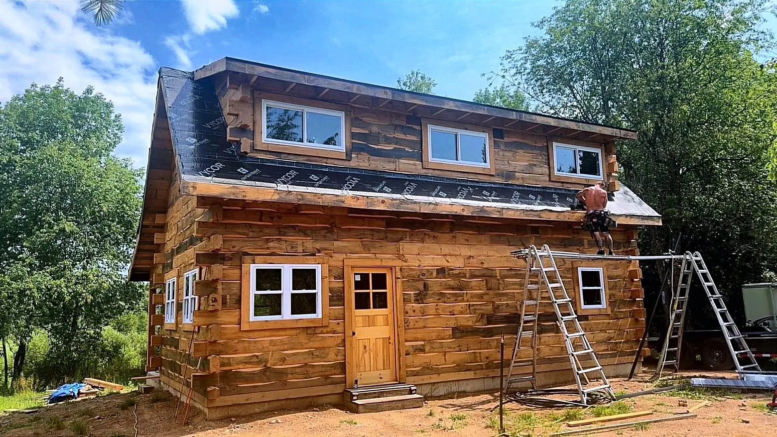 Two-story log home during finishing